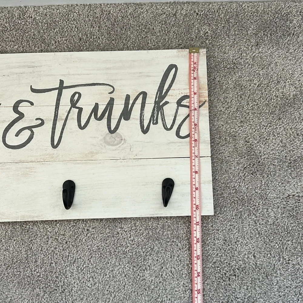 Wooden towels and trunks sign